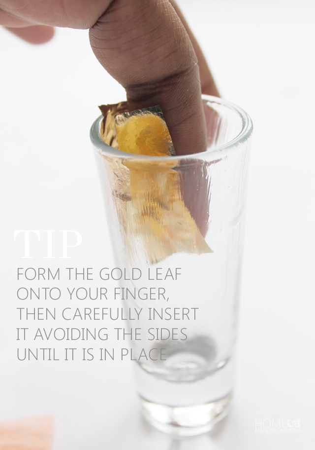 Finger and gold leafing in a shot glass
