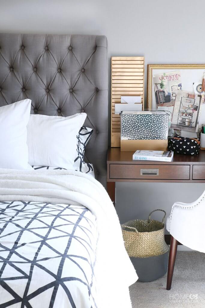 Stylish pin board on bedside table