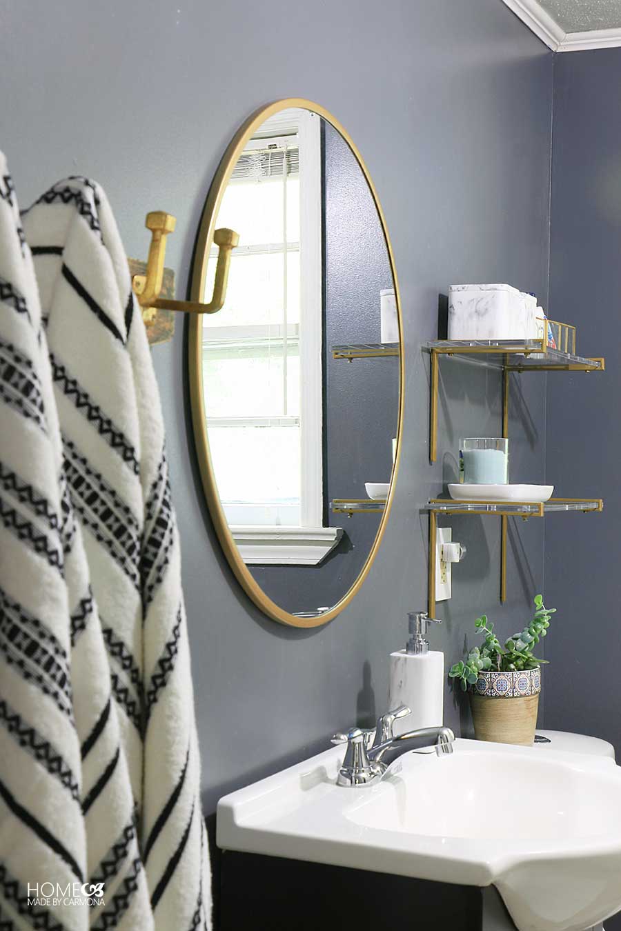 Bathroom mirror sink towels and shelves