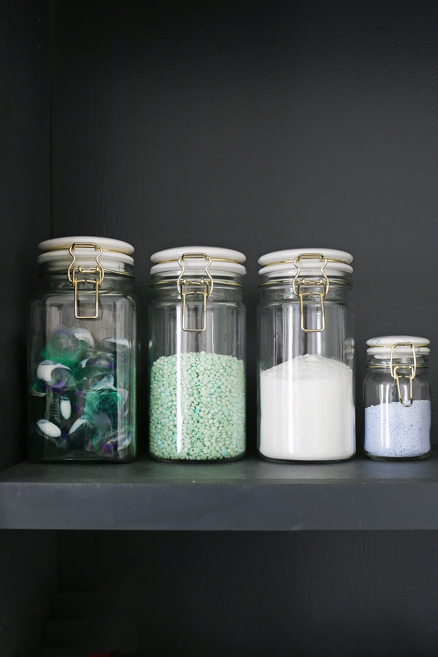 Laundry Room Makeover. Glass jar to hold laundry detergent. - The Modest Mom