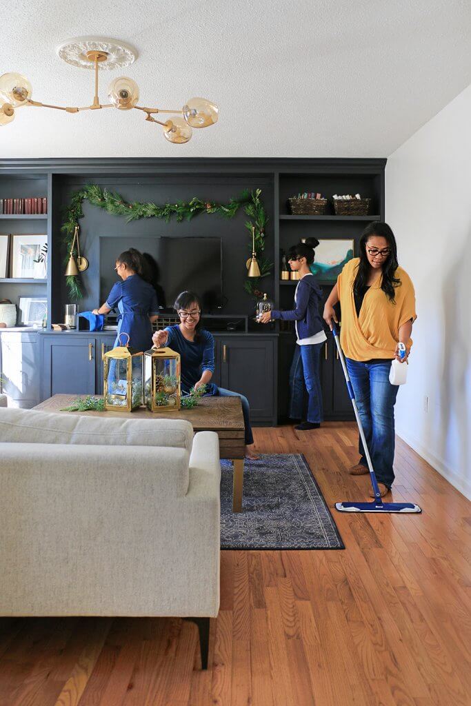 The Carmona family cleaning the living room