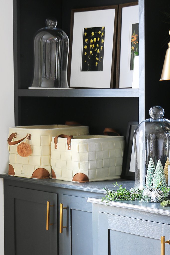 Two storage baskets on a cabinet