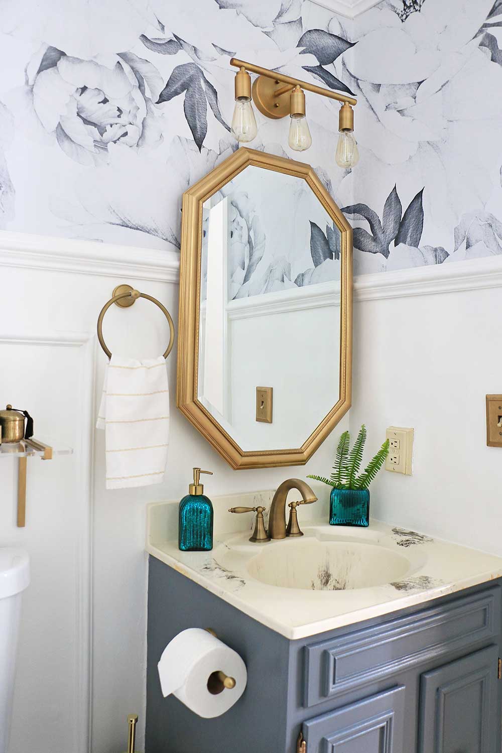 Powder-room-with-brass-fixtures