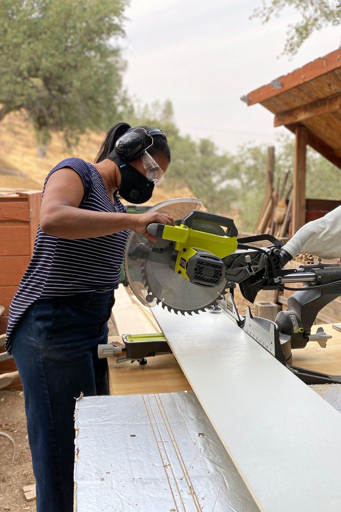 Cutting wood with a miter saw in the outdoors