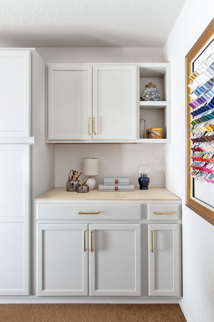 Craft room with organizational pegboard art and storage solutions